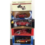 Five various boxed model racing cars, scale 1:18.