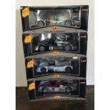 MAISTO: Four various boxed model racing cars, scal