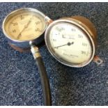 A Masta pressure gauge together with one other. Es