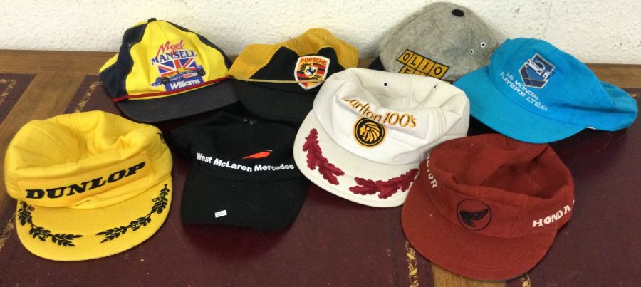 A large collection of Formula 1 souvenir caps. Est