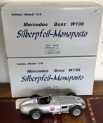 CMC: Two 1:18 scale boxed model racing cars. Est.