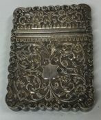 A fine Indian silver card case of chased design. Approx. 116 grams. Est. £150 - £250.