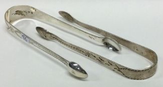 Two pairs of Georgian bright cut silver sugar tongs. London. Approx. 62 grams. Est. £20 - £30.