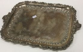 A heavy Continental silver tray with scroll decoration. Approx. 315 grams. Est. £150 - £200.