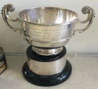 A heavy silver two handled trophy cup on stand. London. Approx. 533 grams.