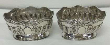 A rare pair of Victorian silver salts in the form of rose bowls. London 1882. By Charles