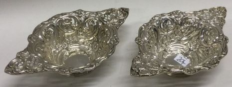A pair of heavy cast silver bonbon dishes with floral decoration. Birmingham. Approx.