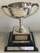 A silver two handled trophy cup on base. Birmingha