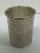 A silver shot cup inscribed, ‘Just a Thimbleful’. Approx. 28 grams. Est. £80 - £120.