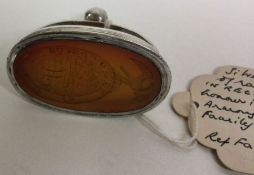 An early 19th Century George III silver and stone seal. Approx. 62 grams. Est £400 - £600.