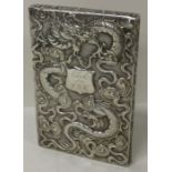 A 19th Century Chinese silver card case with embossed dragons. By Wang Hing.