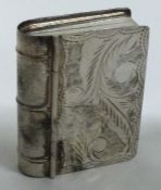 A heavy silver box in the form of a book with engraved decoration. Approx. 21 grams.