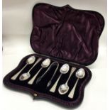 A heavy set of six silver teaspoons together with matching tongs. Sheffield. By HW.