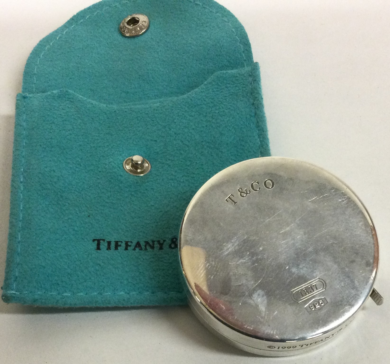 TIFFANY & CO. A rare cased silver tape measure. Approx. grams. Est. £120 - £180.