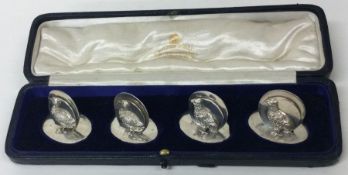 A novelty set of four silver bird cast menu holders. London 1912. By George Brace and Co.