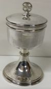 A good quality silver and silver gilt chalice with lift off cover. London. By JW & Co.