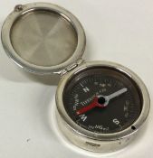 TIFFANY & CO. A rare silver compass with hinged lid. Approx. 35 grams.