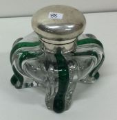 A novelty Victorian silver and green glass inkwell. London 1898. By Hukin and Heath.