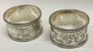A good set of four engraved silver napkin rings. Approx. 112 grams. Est. £70 - £80.