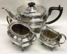 A good shaped silver three piece tea service. London. Approx. 1210 grams. Est. £250 - £300.