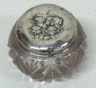 A silver mounted glass box decorated with cherubs. Birmingham. Est. £20 - £30.