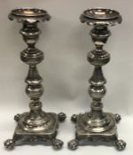 A pair of early 19th Century Continental silver cast candlesticks. Marked to sides.