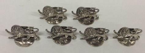 A set of six English silver menu holders in the form of lions. Approx. 70 grams.