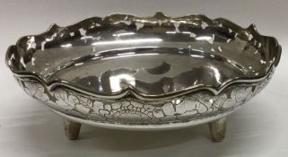 Luen Wo. A fine quality Chinese silver sweet dish with shaped rim on three stem feet. Approx.