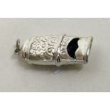 A chased novelty silver whistle. Approx. grams. Est. £20 - £30.