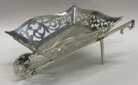 A large novelty silver basket in the form of a wheelbarrow. Birmingham 1909. Approx.
