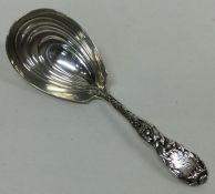 TIFFANY & CO: A silver caddy spoon. Approx. 31 grams. Est. £150 - £200.