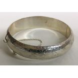 A heavy silver bracelet engraved with flowers. Birmingham 1941. By HS Ltd. Approx.