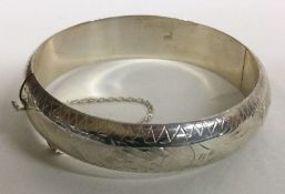 A heavy silver bracelet engraved with flowers. Birmingham 1941. By HS Ltd. Approx.