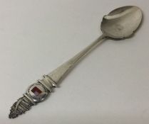 OF SHIPPING INTEREST: A silver jam spoon decorated with an enamelled flag commemorating