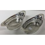 A pair of oval pierced silver dishes. Birmingham. Approx. 109 grams. Est. £40 - £60.