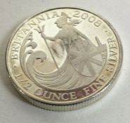 A silver half ounce Britannia coin. Approx.17 grams. Est. £15 - £20.