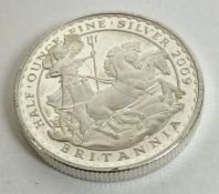 A silver half ounce Britannia coin. Approx. 17 grams. Est. £15 - £20.