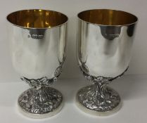A fine quality pair of Victorian silver goblets with cast feet. London 1863. By John Samuel