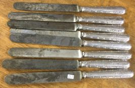 A set of eight George III silver knives. Circa 1800. By William Summer.