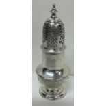 A George II silver sugar caster of Rococo design. London 1743. Approx. 164 grams. Est. £300 - £500.