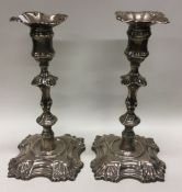 A heavy and fine pair of 18th Century silver cast candlesticks. London 1761. By William