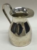 A modern plain silver cream jug. London. Approx. 86 grams. Est. £30 - £40.