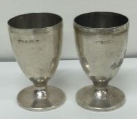 A novelty pair of silver egg cups. Birmingham 1920. By George Unite. Approx. 50 grams. Est. £40 - £6