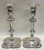 A fine pair of 18th Century silver cast candlestic
