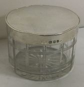 A fine silver and glass box lift off lid. London 1934. By Mappin and Webb. Approx. grams. Est £40 -