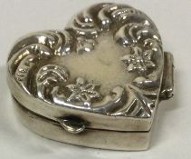 A heart shaped English silver hinged box marked underneath.