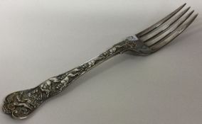 A heavy cast silver stag hunt pattern table fork. Approx. London 1985. Approx. 136 grams.