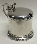 A silver mounted glass mustard pot. London 1874. By George Fox. Approx. 122 grams.