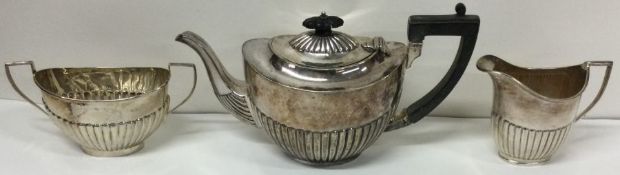 A heavy silver half fluted tea service. Birmingham. Approx. 514 grams. Est. £100 - £150.