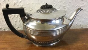 A small silver half fluted teapot. Sheffield. Appr